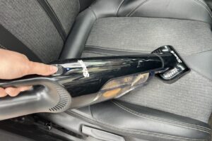 Eufy by Anker HomeVac H11 cleaning crumbs from sofa